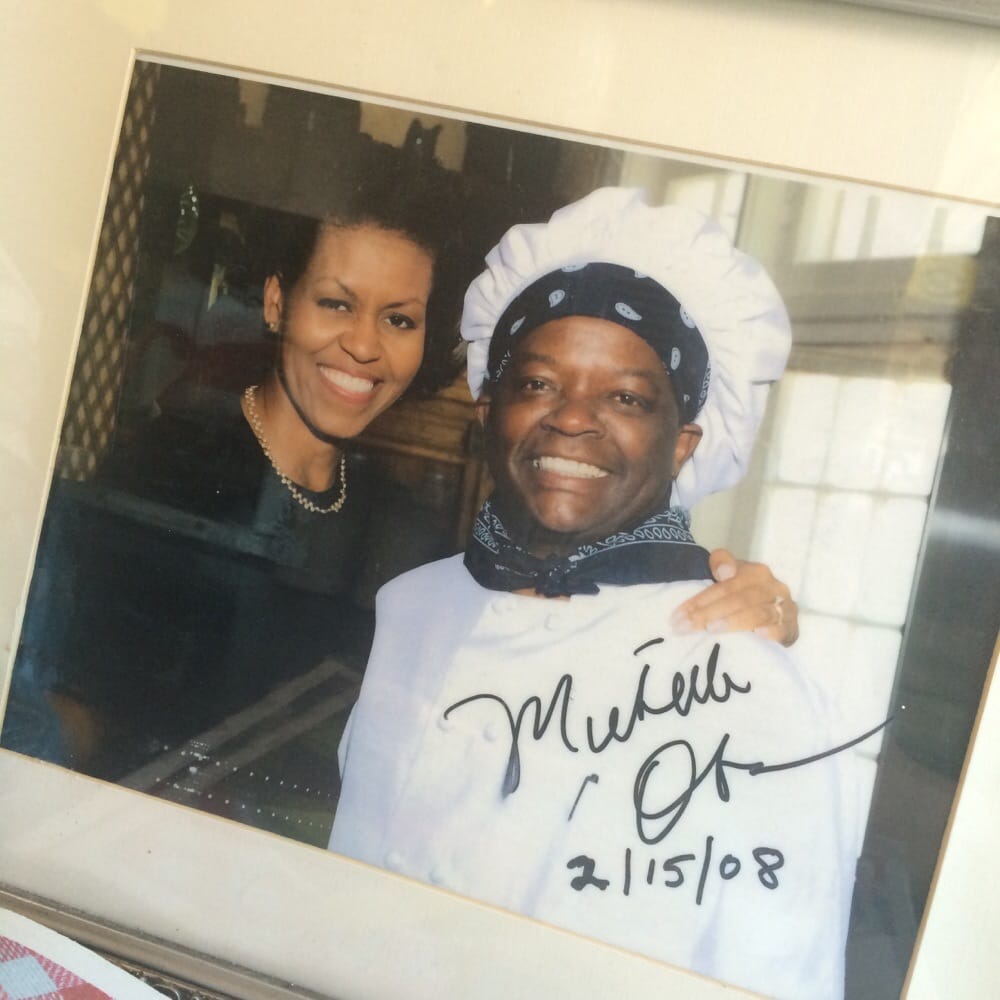 Signed photo of First Lady Michelle Obama with the owner, 2008